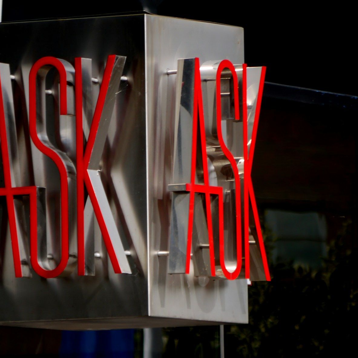 red and grey Ask signage